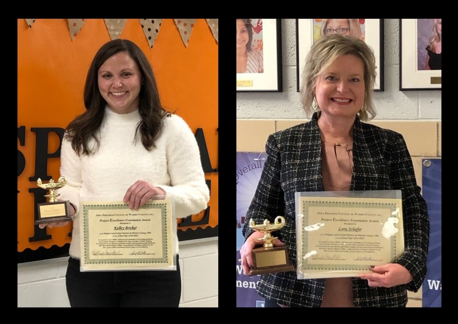 2 women holding certificates and trophies